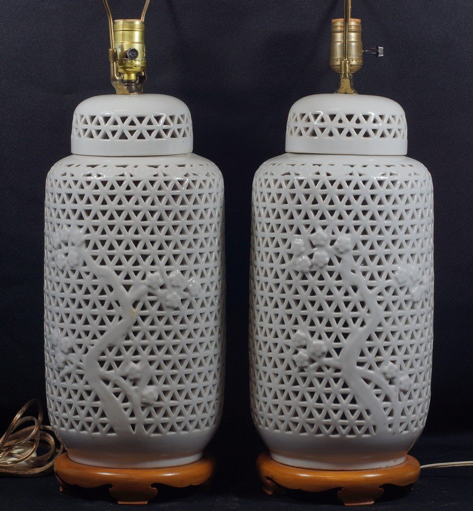 Pair of Hollywood Regency Blanc De Chine pierced ginger: Pair of Hollywood Regency Blanc De Chine pierced ginger jars mounted as lamps, jars approx 16" high, overall to top of harp 29"