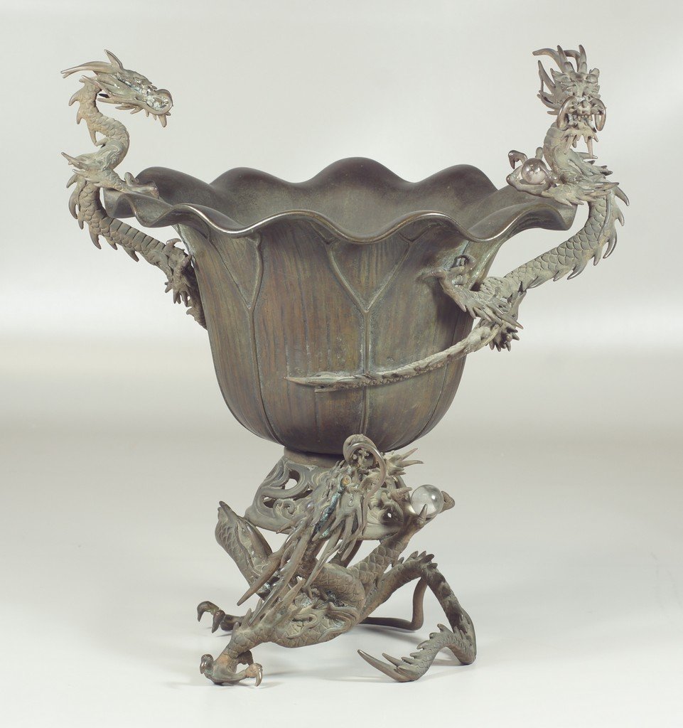 Japanese bronze planter, the bowl entwined with 2: Japanese bronze planter, the bowl entwined with 2 dragons, on a dragon form base grasping a glass pearl, 13 1/2" h overall, 10 1/2" d, probably 2nd half 19th c
