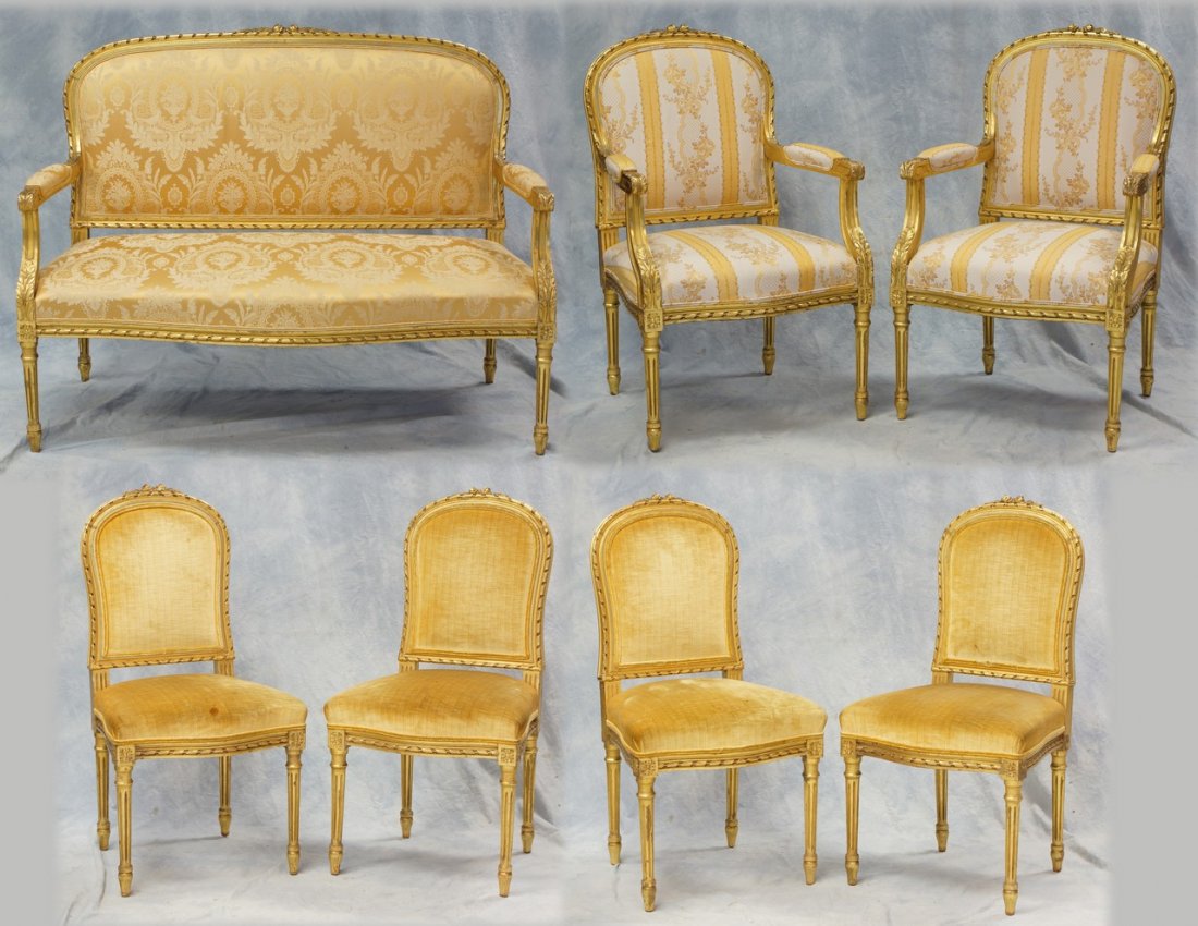 7 pc carved & gilt Louis XVI style parlor suite, c/o: 7 pc carved & gilt Louis XVI style parlor suite, c/o settee, 53" w, 2 armchairs, 4 side chairs, in a gold floral silk upholstery, late 19th /20th c