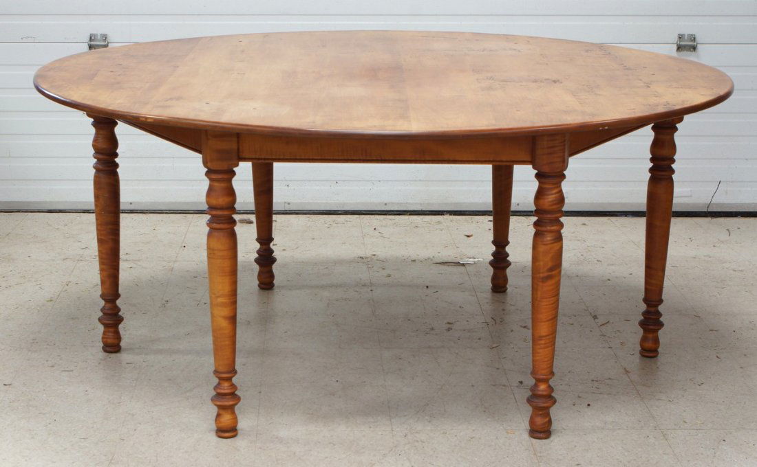 Figured Maple round dining table, 6 leg base, allowing: Figured Maple round dining table, 6 leg base, allowing perfectly for 6 person seating, late 20th century, unsigned, 67-3/4" diameter