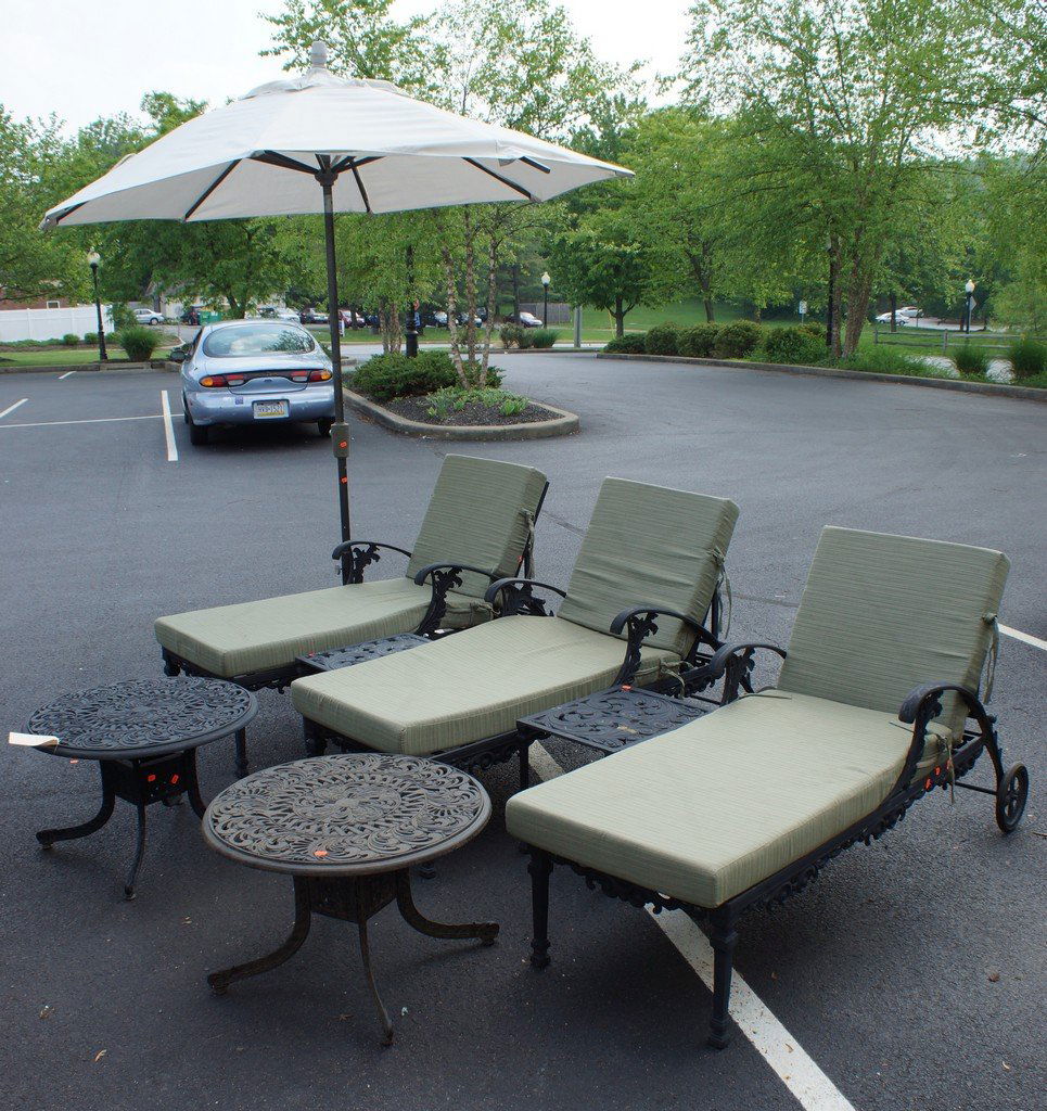 3 patio chaise lounges, 56" long, with 2 round low: 3 patio chaise lounges, 56" long, with 2 round low tables, 27-1/2" diameter, and 2 small square tables, 19" square, and free standing umbrella, by Outdoor Lifestyle, Gastonia, NC