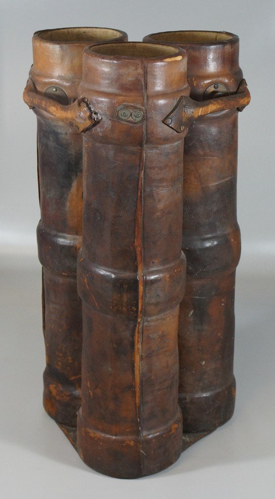 3 section leather cannon ball carrier, 24" h, 12" w,: 3 section leather cannon ball carrier, 24" h, 12" w, probably 19th/early 20th c