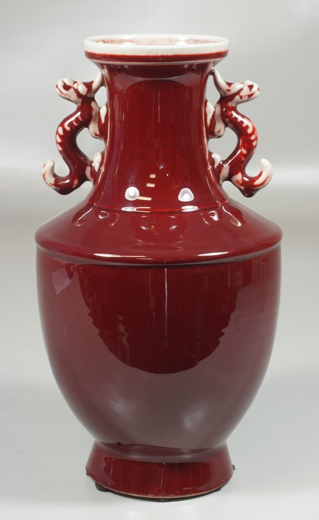 Chinese Sang De Boeuf with stylized dragon handles and: Chinese Sang De Boeuf with stylized dragon handles and incised mark to base, 13" high, chip to base