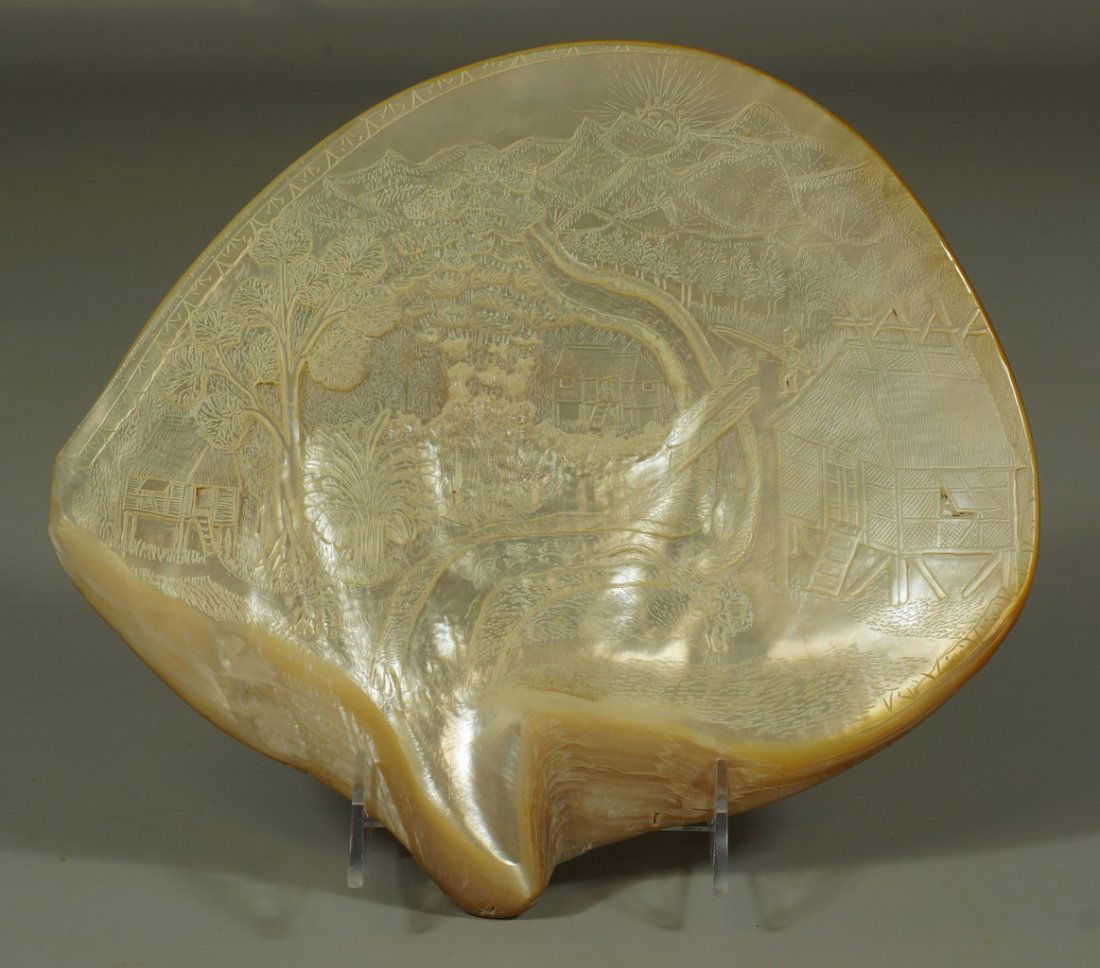 Chinese carved mother of pearl shell, scenic design: Chinese carved mother of pearl shell, scenic design with river, fish, and huts, 10" wide