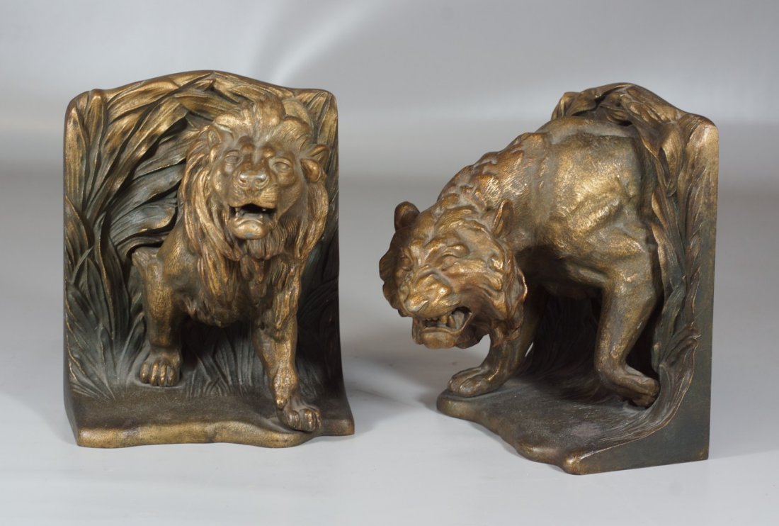 Pr Bradley & Hubbard standing lion cast iron bookends,: Pr Bradley & Hubbard standing lion cast iron bookends, gold finish, 7" tall, excellent condition, signed