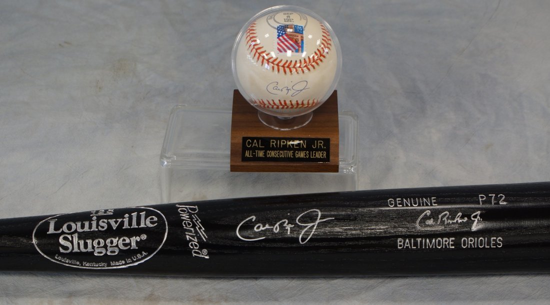 Cal Ripken Jr, autographed Official American League: Cal Ripken Jr, autographed Official American League Rawlings baseball, date stamp September 6 1997, signed on the sweet spot, with Ripken logo, and autographed 125 Louisville Slugger, black bat, silve