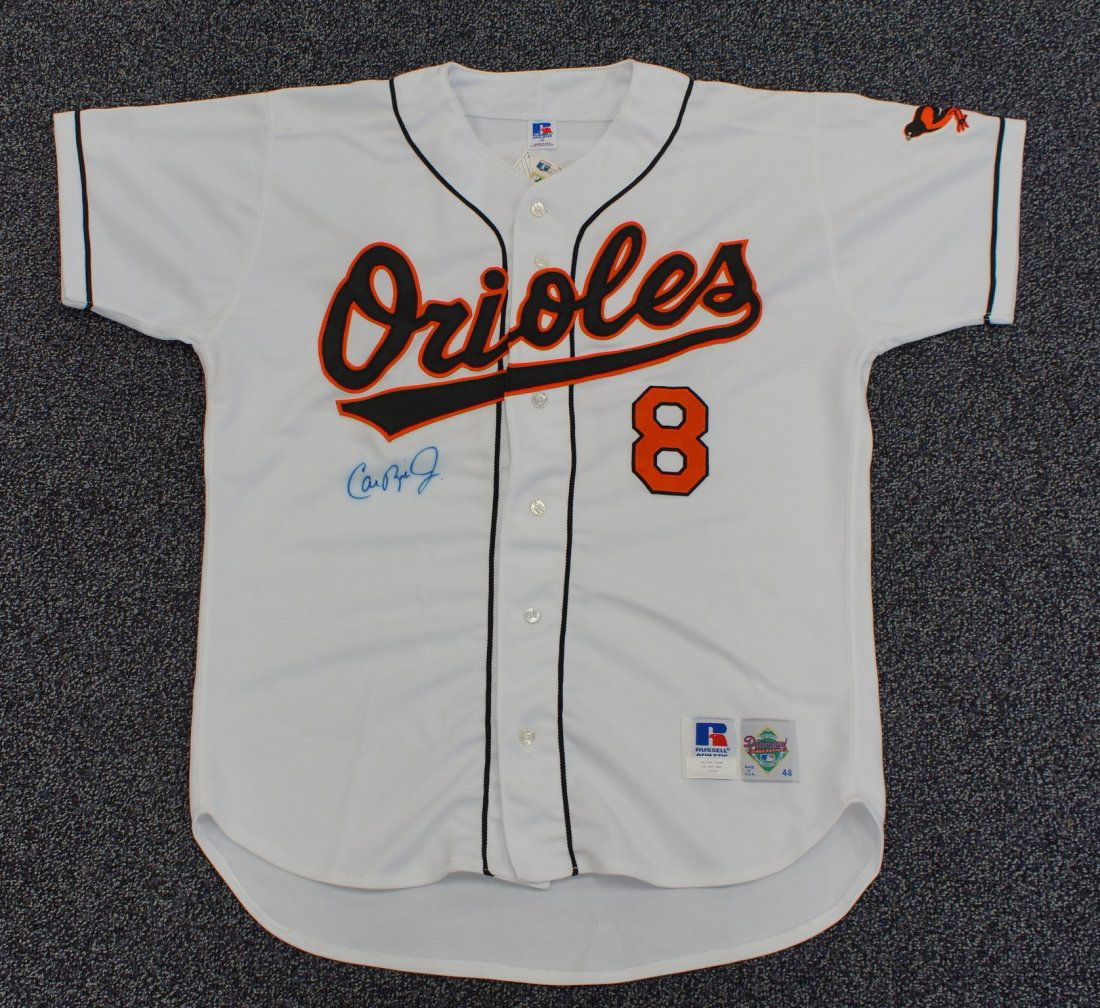 Cal Ripken Jr., Autographed Russell 48 White Jersey -: Cal Ripken Jr., Autographed Russell 48 White Jersey - Blue Ink on Front with Ken Goldin Scoreboard COA