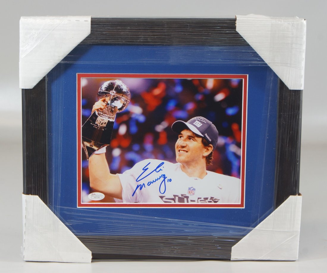Eli Manning signed photograph post Superbowl, framed: Eli Manning signed photograph post Superbowl, framed and matted overall 14-1/2" x 16-3/4", with JSA COA