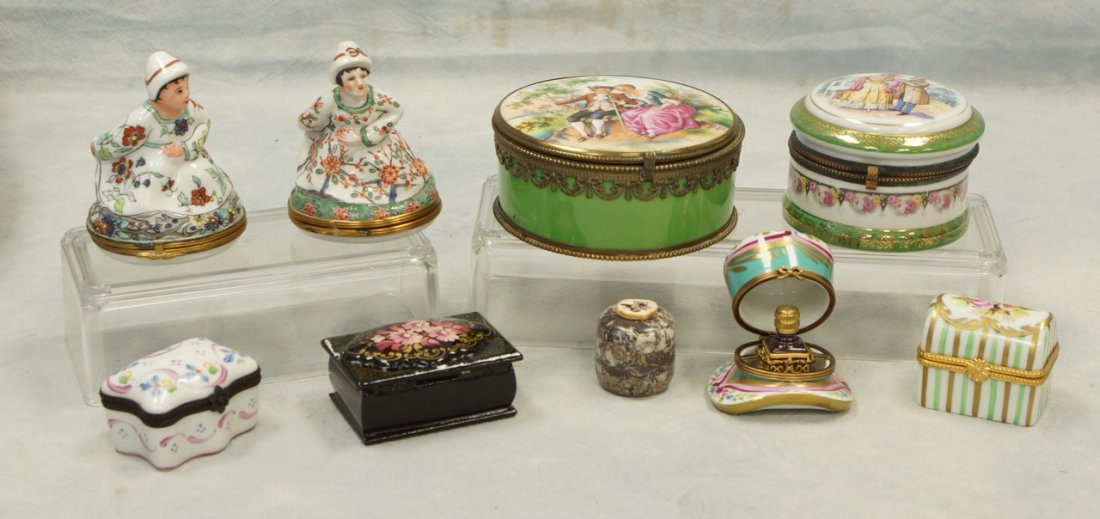 (7) decorated porcelain dresser boxes, 3 w/Limoges: (7) decorated porcelain dresser boxes, 3 w/Limoges marks, 2 w/Czechoslovakia marks, largest 4" d, plus a paper mache Russian dresser box and a stone box