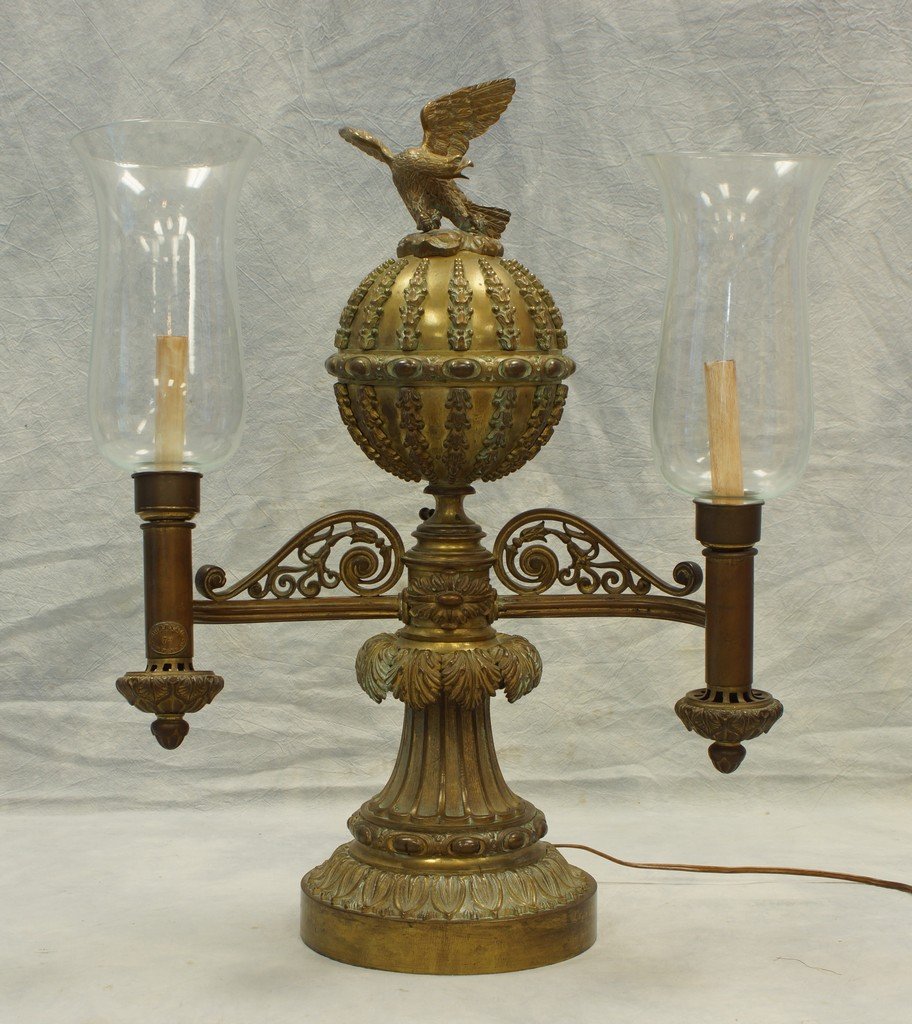 Bronze double-arm Argand lamp by Perry & Co, 72 New: Bronze double-arm Argand lamp by Perry & Co, 72 New Bond St, London, electrified, top with removable Eagle finial over a globular fuel font, over a base with Acanthus leaf designs, 24" height, William