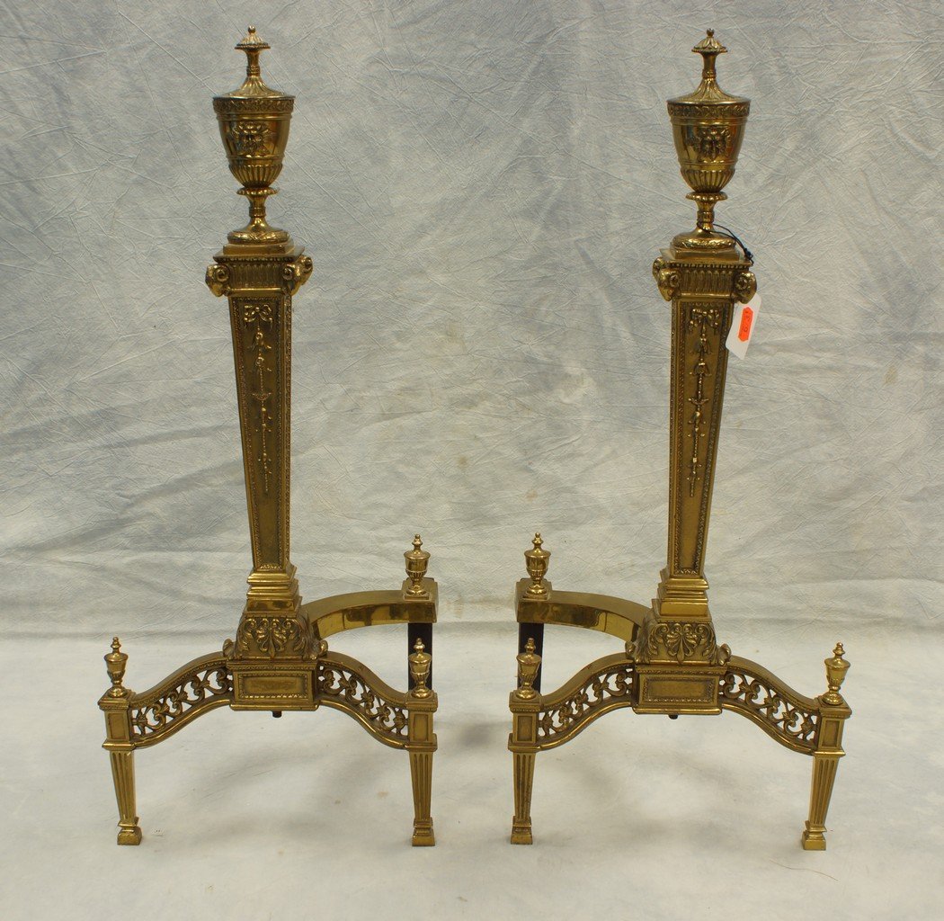Pair of Regency brass andirons, with rams head and grot: Pair of Regency brass andirons, with rams head and grotesque mask, bell flowers on shaft, 25" height