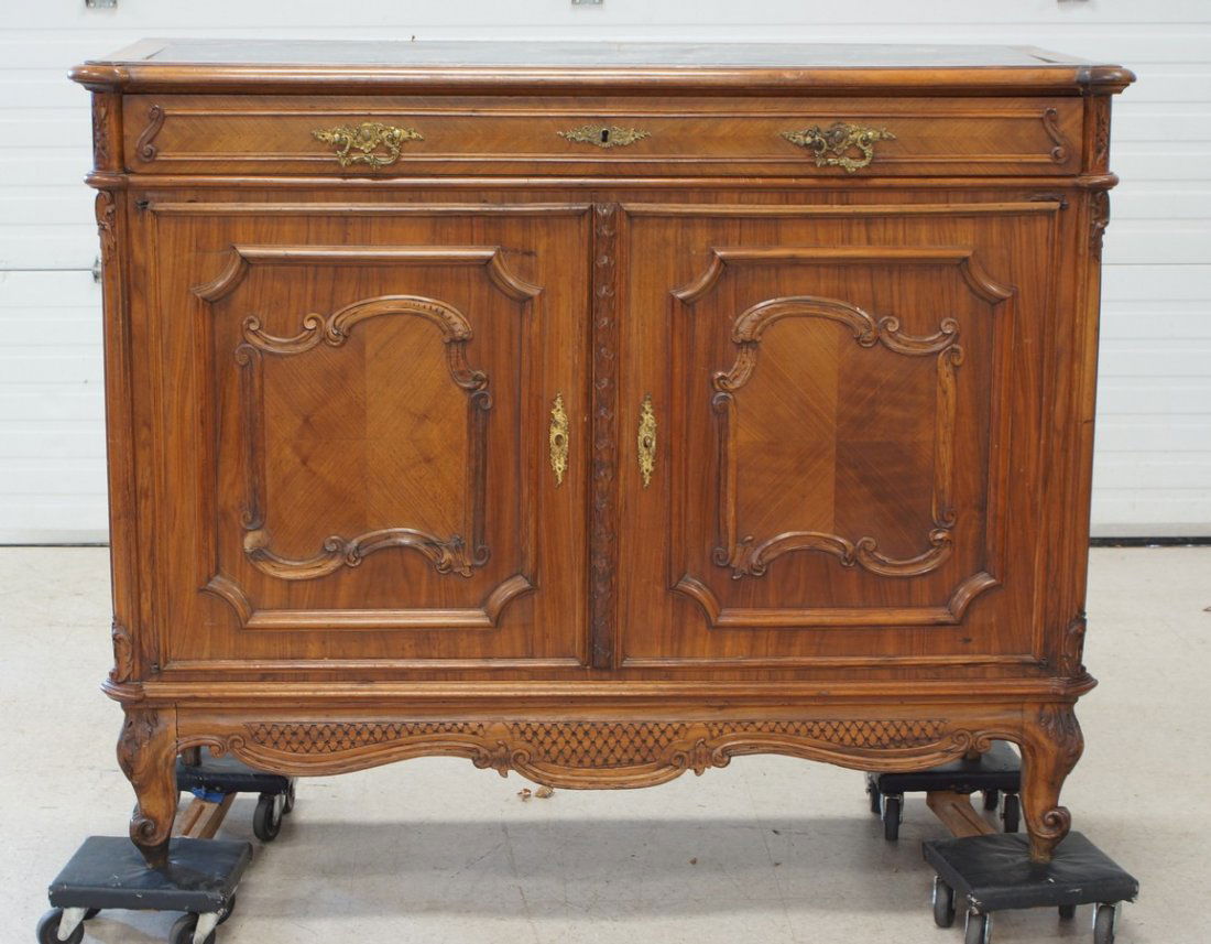 Carved walnut black marble top French credenza, long: Carved walnut black marble top French credenza, long drawer over 2 doors, 52" w x 42" h