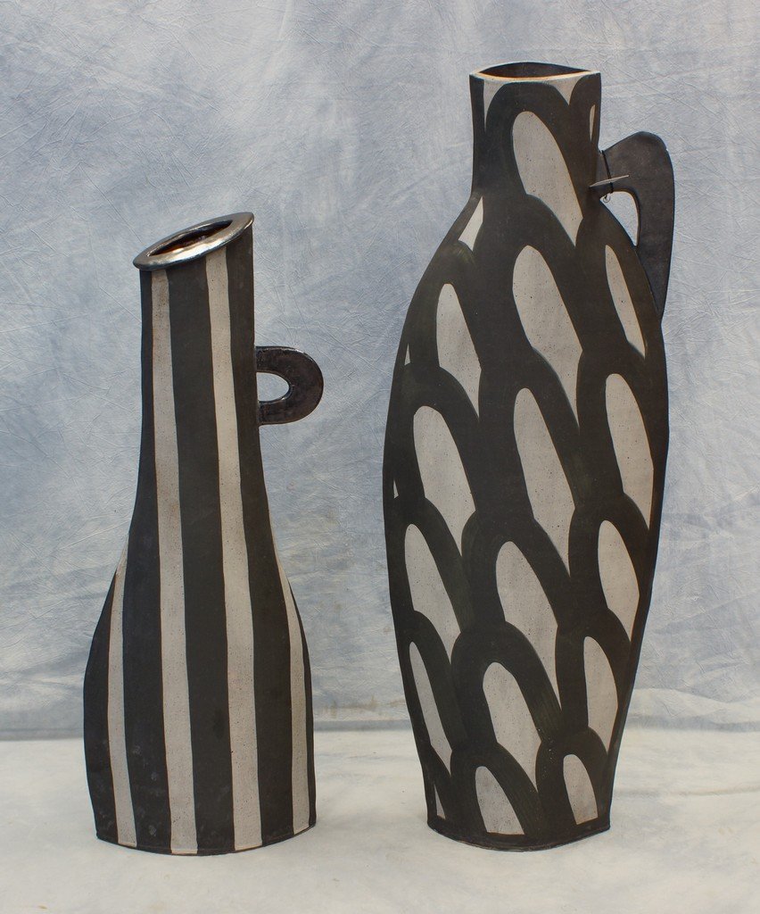 (2) gray and white striped modern design sculptures in: (2) gray and white striped modern design sculptures in the form of pitchers, signed ????? Matthews, 38", 30 1/2" high