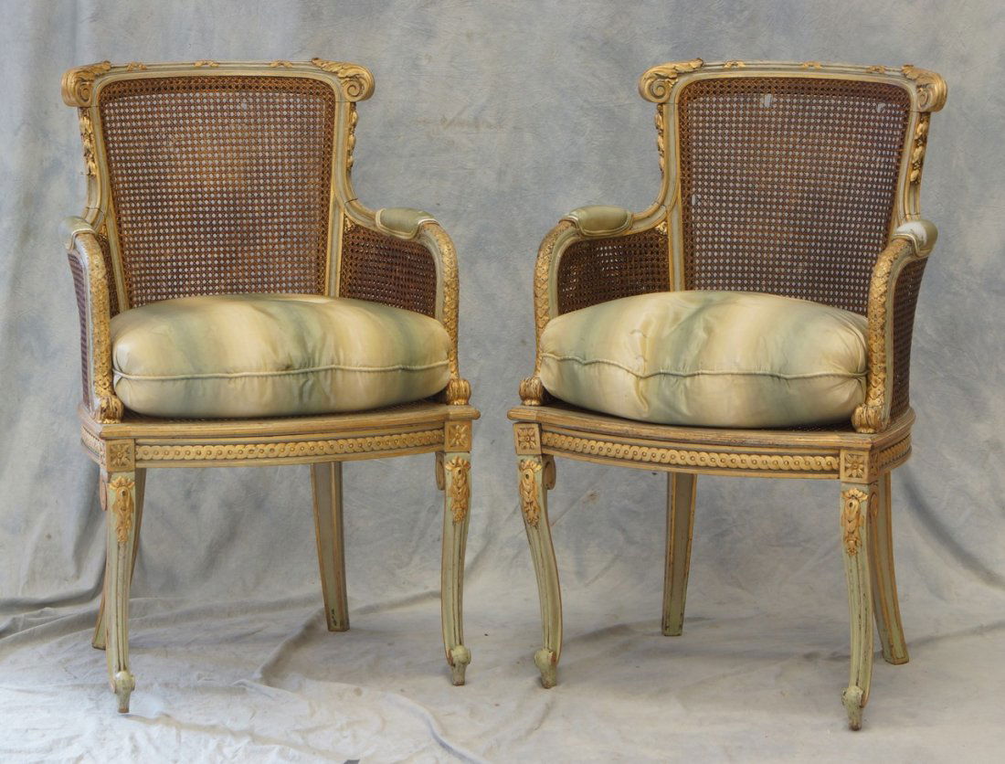 Pr of Light Blue and Gold painted Italian-style arm: Pr of Light Blue and Gold painted Italian-style arm chairs with caned backs, seats, and sides, Some damage to caning in worn silk upholstery with down pillows, 37"h