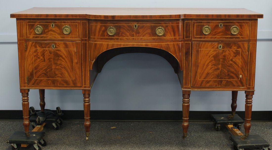 Regency inlaid mahogany sideboard, central bow front: Regency inlaid mahogany sideboard, central bow front drawer flanked by drawer and door on each side, raise on turned legs, 37"h, 69-3/4" w, 30" d