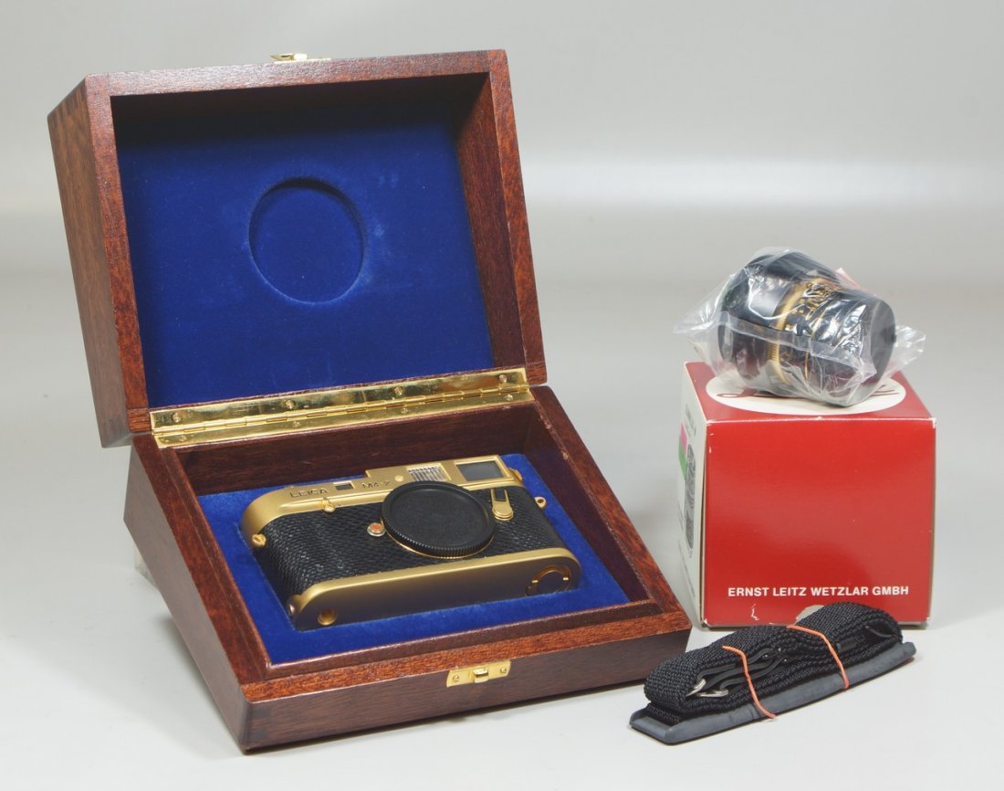 Leica M4-2 24K Gold Plated O Barnack Commemorative: Leica M4-2 24K Gold Plated O Barnack Commemorative Camera, with unopened Summilux-M 1.4/50mm lens #2980621, Body SN 1528348 (100-0965). In 1979, 1,000 Gold M4-2 cameras with matching Summilux-M 1.4/50