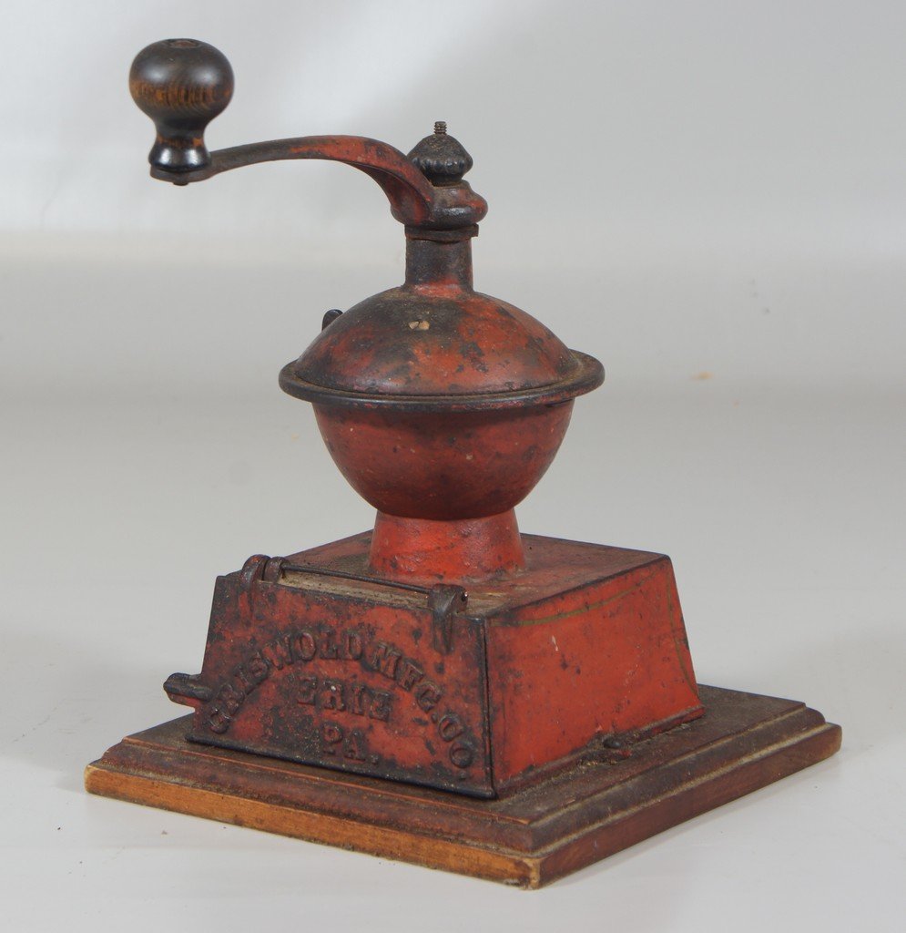 Griswold Mfg Co cast iron coffee grinder on newer wood: Griswold Mfg Co cast iron coffee grinder on newer wood base, original red paint with pinstriping, 11" tall to top of handle, iron base 5 1/4" sq, lacking interior pan