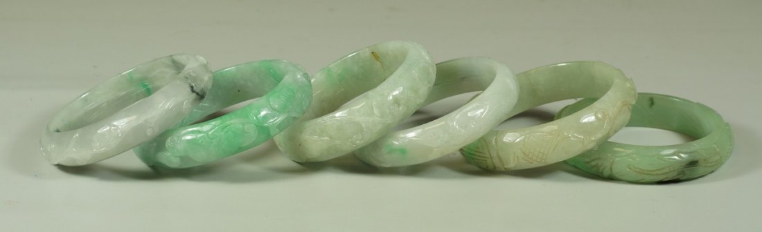 6 Chinese carved hardstone bracelets, largest 2-3/4": 6 Chinese carved hardstone bracelets, largest 2-3/4" diameter, 1 cracked