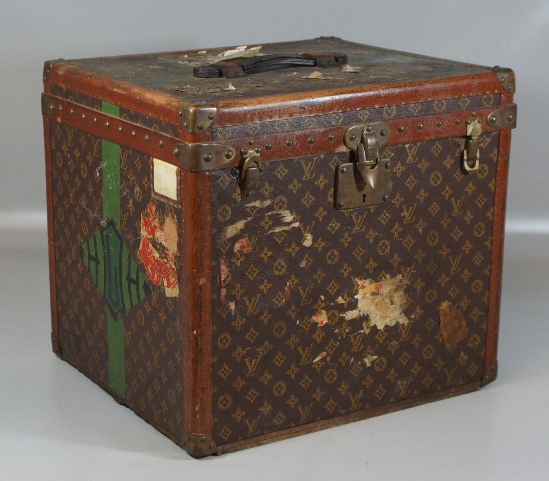 Louis Vuitton hat box or trunk, remainder of steamship: Louis Vuitton hat box or trunk, remainder of steamship and shipping labels on exterior, interior with LV tag, SN 752515, c 1921, no evidence of any inserts, 20" w, 17 1/2" d, 18" h, handle on top, HHL