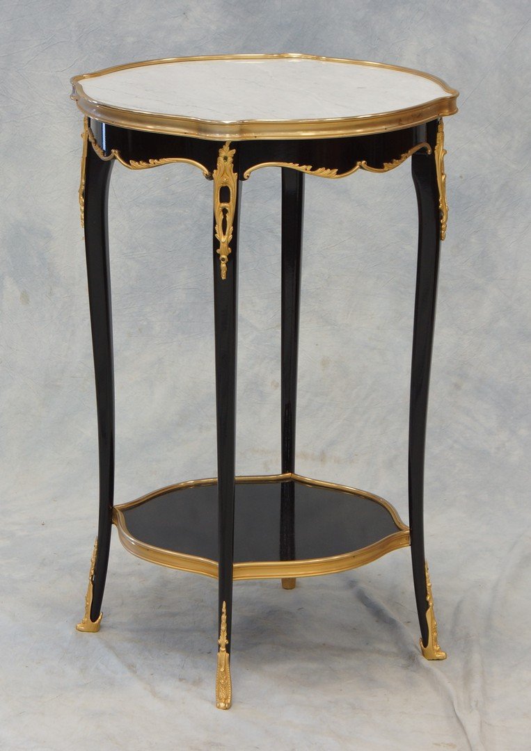 Louis XIV style ebonized marble top table with ormolu: Louis XIV style ebonized marble top table with ormolu mounts, serpentine shaped top, 29" h, 18 1/2" d, 19th c