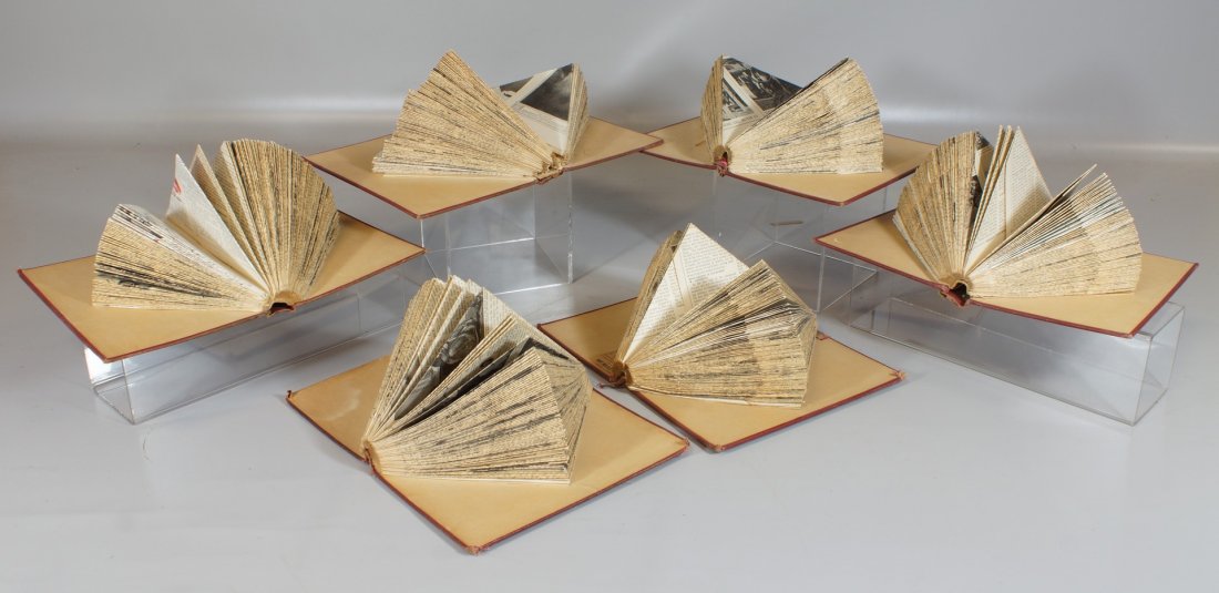 Ralph Busch, American, Late 20th Century, from the: Ralph Busch, American, Late 20th Century, from the "Encyclopedia" Series, 6-section wall hanging made of the bindings of books that is opened with the pages folded in a triangle, all folded together t