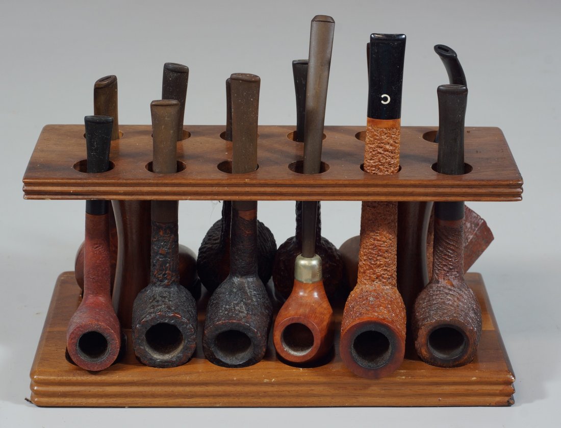 Wooden pipe stand with 12 pipes to include Churchwarden
