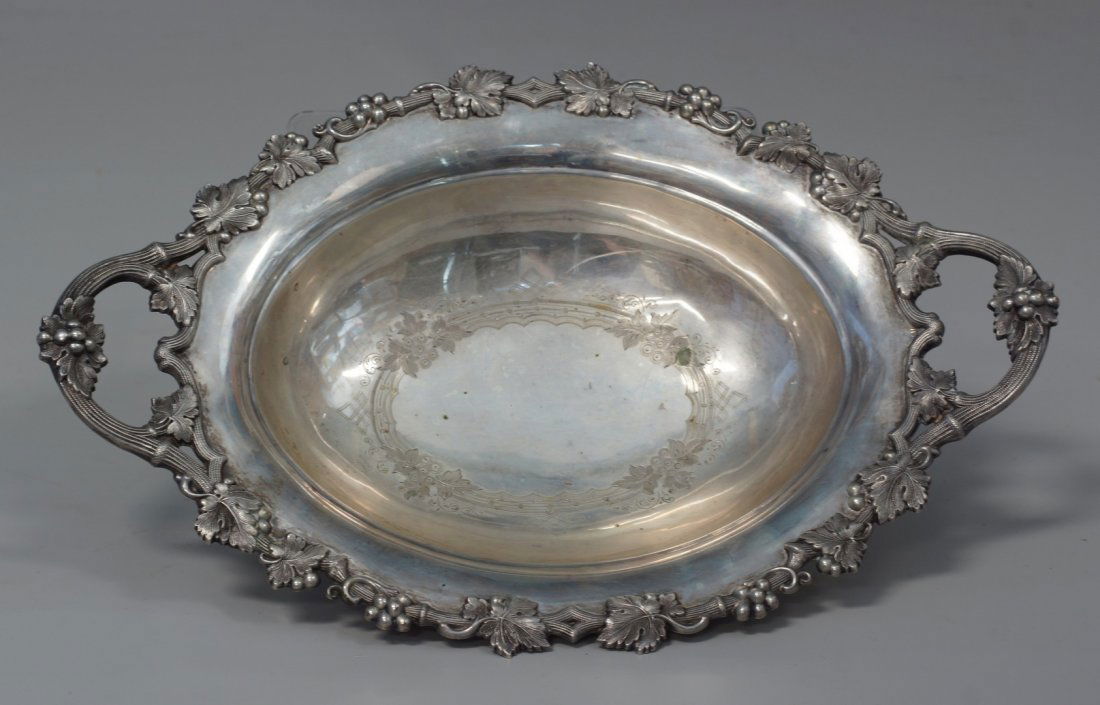 Austro-Hungarian 13 lothige (812 assay) silver oval: Austro-Hungarian 13 lothige (812 assay) silver oval footed bowl, inscription dated 1870 to side, grapevine border, 13 1/2" long, stamped 13 at one end, 10.19 TO, legs pushed into body a bit