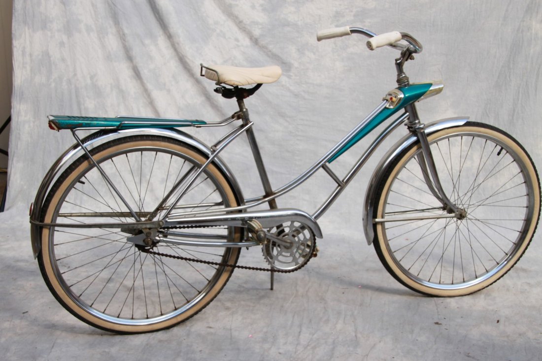 Sears girl's 26 x 1.75 bicycle; aquamarine and chrome: Sears girl's 26 x 1.75 bicycle; aquamarine and chrome (light and horn intact but do not work, light housing cracked, some surface marks and rust, some paint rubbed off) 38"h x 70"l x 18"w