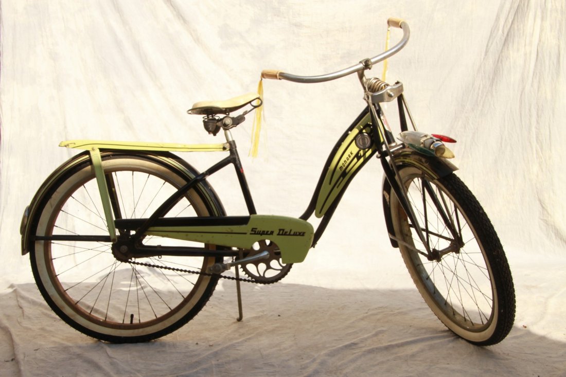 Monark Super Deluxe girl's 24 x 2.125 bicycle; black: Monark Super Deluxe girl's 24 x 2.125 bicycle; black and mint green, front shock, Delta Electric Co. Jet Rocket light system 38-1/2"h x 64"l x 18"w