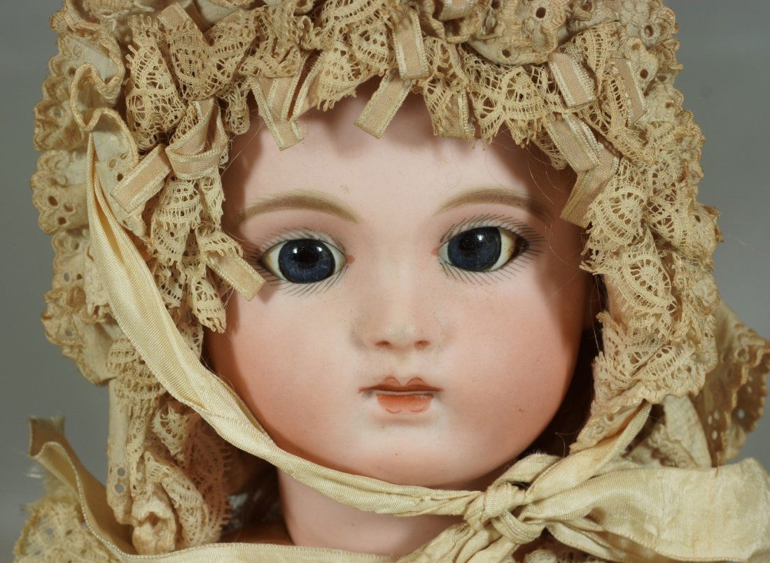 French Bebe bisque head doll; jointed composition body,: French Bebe bisque head doll; jointed composition body, blue sleep eyes, closed mouth, pierced ears, cork pate, original mohair wig, overall condition is good, 20"tall