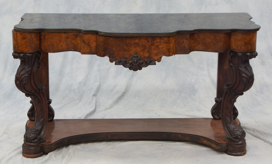 Carved walnut Victorian credenza with newer glass top,: Carved walnut Victorian credenza with newer glass top, drawer in apron, carved legs, open base with a lower shelf with formica covering, 53" w