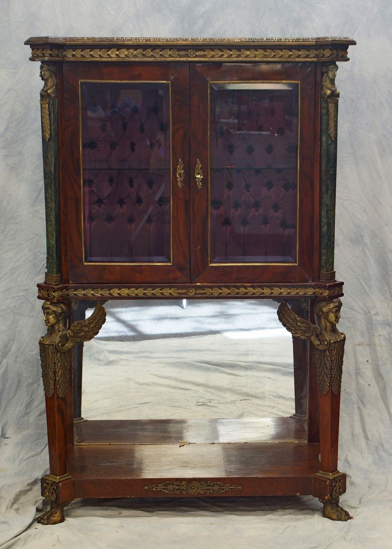 Bronze mounted French Empire style display cabinet,: Bronze mounted French Empire style display cabinet, marble & bronze mounts, bowed glass ends, beveled front glass, winged ladies at base, paw feet, 61" h, 40" w, 18 1/2" d, 19th c, some veneer losses
