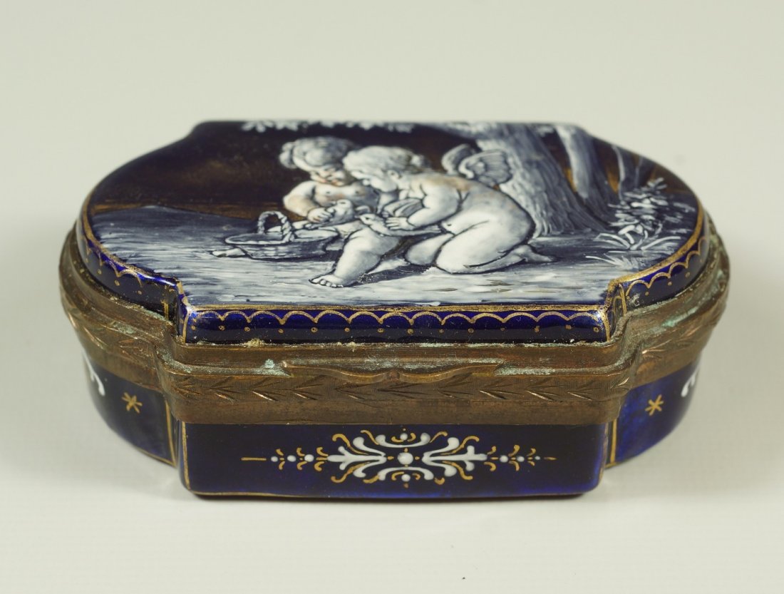 Limoges enameled dresser box depicting 2 cherubs with: Limoges enameled dresser box depicting 2 cherubs with lovebirds, enameled interior, trophies of love enameled to base, 2 3/4" x 1 3/4"