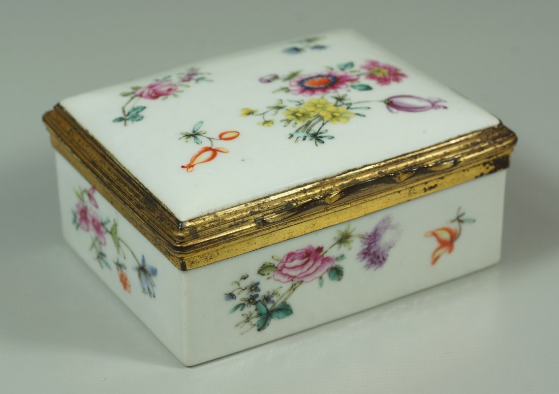 18th Century French or Continental porcelain snuff box,: 18th Century French or Continental porcelain snuff box, fire gilt ormolu mounts, 2 small repairs, 3 1/4" x 2 3/4" x 1 1/4" h