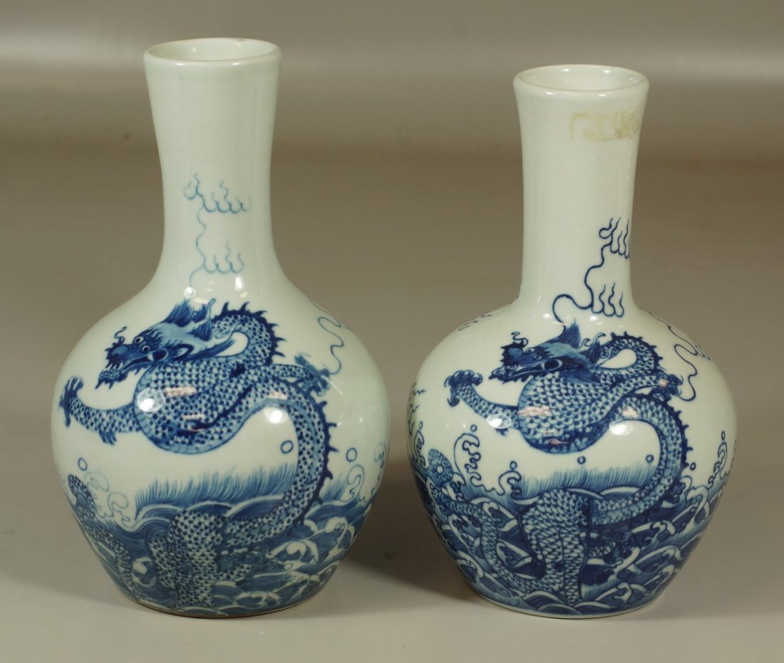 2 Chinese blue and white dragon decorated vases, marks: 2 Chinese blue and white dragon decorated vases, marks to base, 9 1/2" height