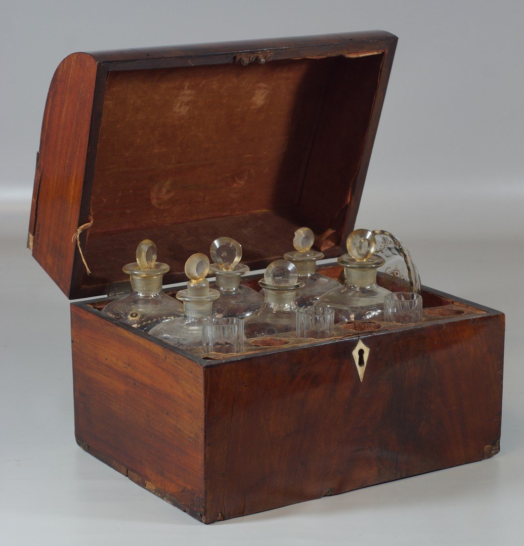 Mahogany traveling liquor chest, 18th Century, fitted: Mahogany traveling liquor chest, 18th Century, fitted with glass bottles and shot glasses and small oval bowl, all with gilt highlights, 9" high, 12" wide, missing 3 glasses