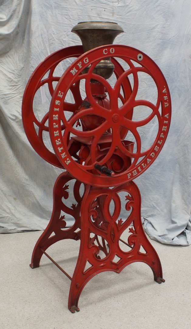 Enterprise Mfg Co floor model cast iron coffee mill,: Enterprise Mfg Co floor model cast iron coffee mill, Philadelphia, USA, pat July, 12, '98, No 18, 5' high, 31" wheel, one wheel handle missing, repainted, hopper lid missing.