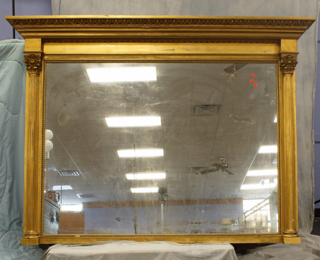 Federal gilt over mantle mirror, egg and dart cornice,: Federal gilt over mantle mirror, egg and dart cornice, mirror plate flanked by fluted columns topped with Corinthian capitals, original gold leaf finish, some minor chips and losses, 61" high, 74-1/2"
