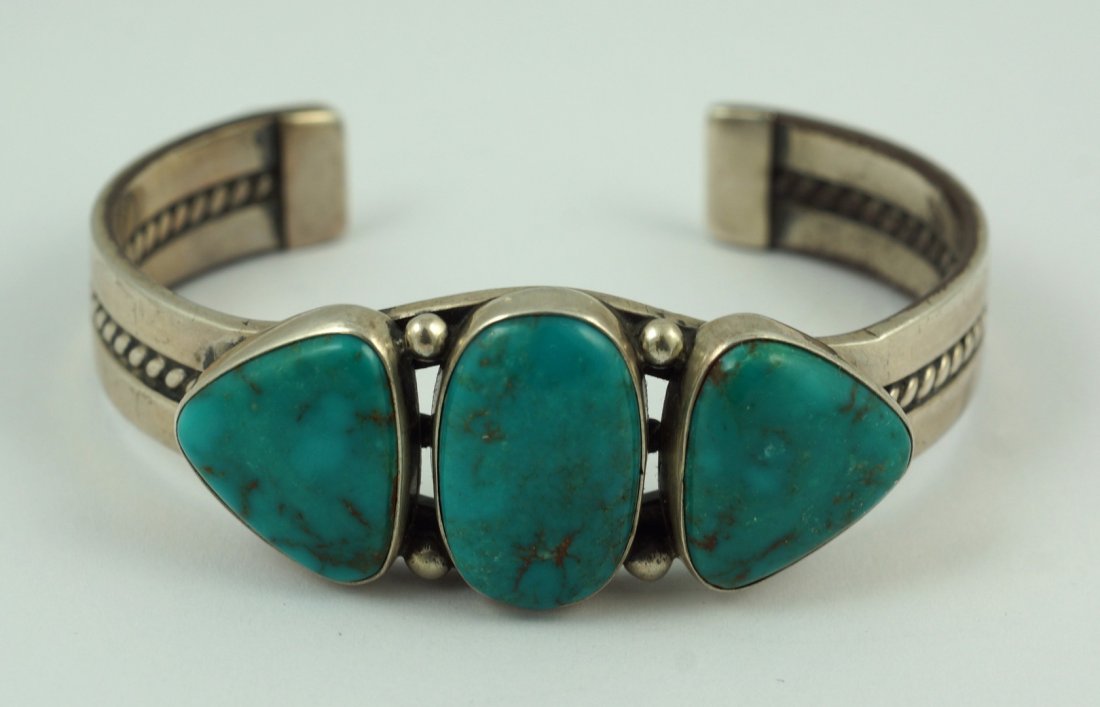 Sterling silver & turquoise traditional Navajo: Sterling silver & turquoise traditional Navajo bracelet, 3 bezel turquoise stones, could be Blue Gem turquoise, marked "LD", could be Lowell Draper, 2 1/4" wrist x 1" wide, 1.32 TO