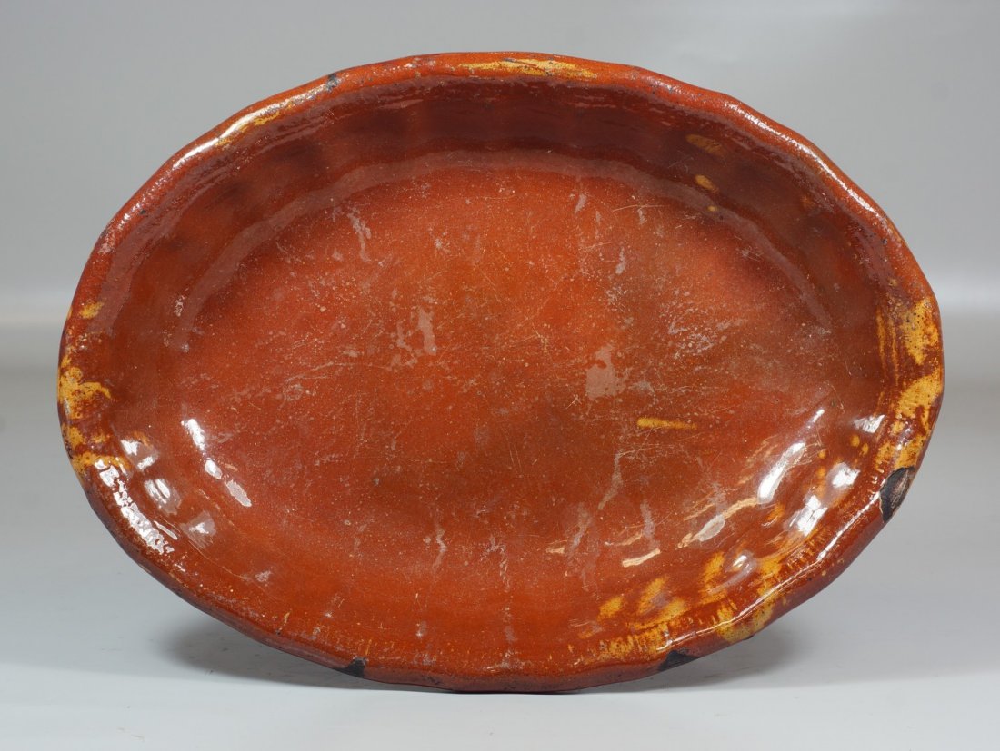 Mexican oval redware platter with scalloped edge,: Mexican oval redware platter with scalloped edge, 15-1/2", chips to edge
