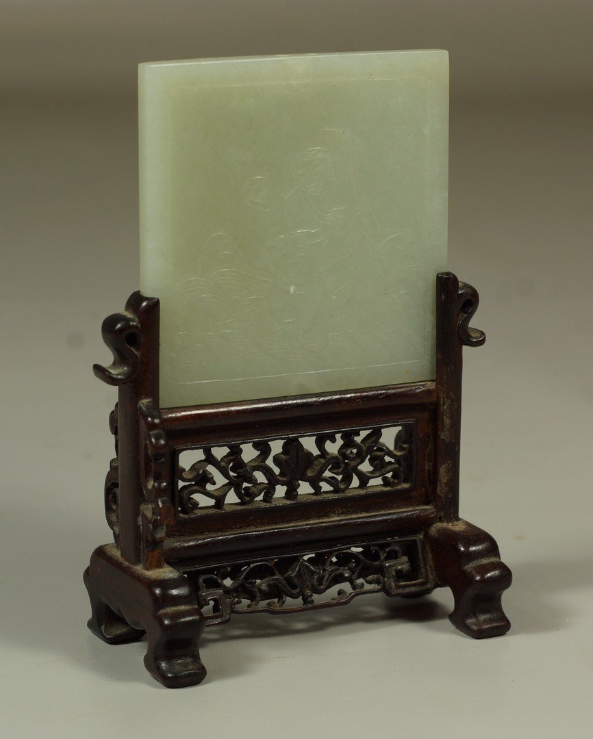 Small Chinese carved jade table screen; teak base with: Small Chinese carved jade table screen; teak base with losses, one side depicts Liu Hai and his money toad, the other side is a maiden with crane and bat, approximately 5 1/4" high