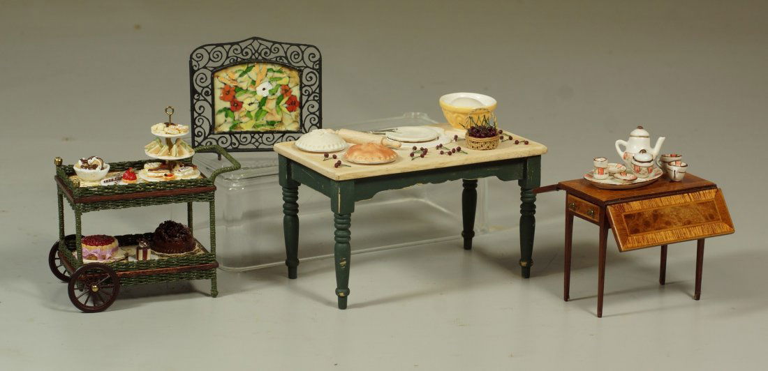 5 pc hand made doll house furniture, comprised of a: 5 pc hand made doll house furniture, comprised of a kitchen table, tea cart, drop leaf table, tea set and a fire screen. Some signed. Tallest 3-1/4". Nice condition.