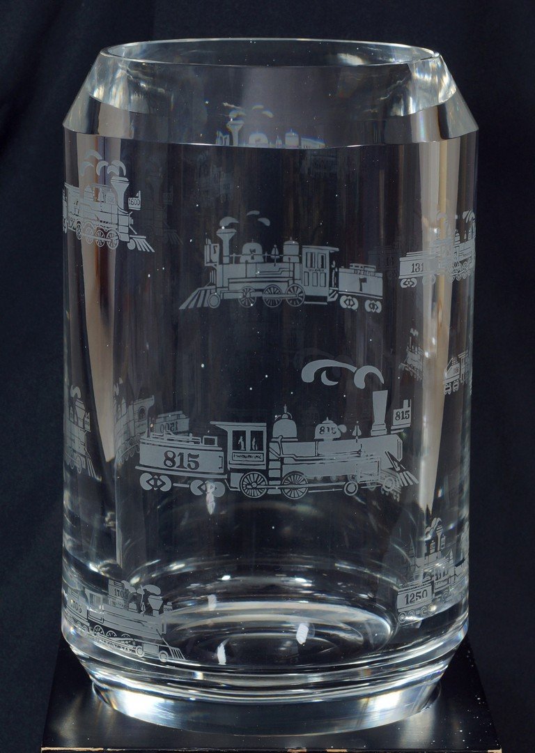Tiffany & Company glass vase, Ward Bennett Design,: Tiffany & Company glass vase, Ward Bennett Design, labeled Union Pacific Corporation, First National City Bank, February 1898-1973, etched with train motifs, on a wood base, glass 10-1/2", 14" overall