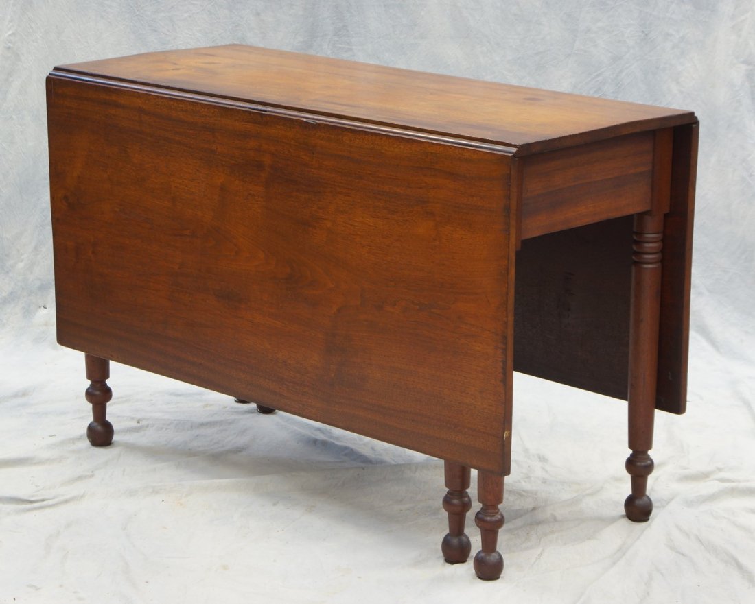 Walnut Sheraton drop leaf table w/turned legs, 29": Walnut Sheraton drop leaf table w/turned legs, 29" high, 45" length, 20" deep, 52" extended. Nice condition.