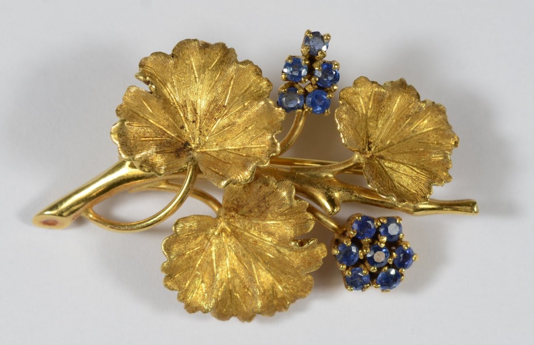 18K YG grape leaf and cluster pin, 2 clusters set with: 18K YG grape leaf and cluster pin, 2 clusters set with a total of 12 pale blue stones, 1 5/8" l, 5.4 dwt, stamped 18K / Italy