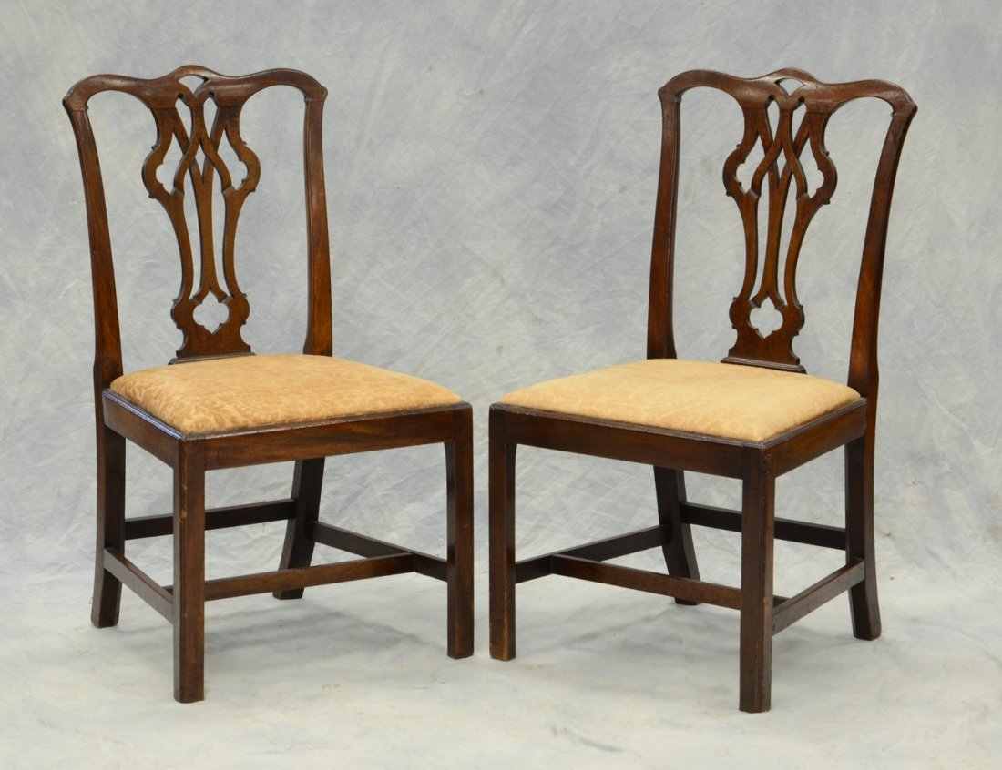 Pr George III mahogany Chippendale side chairs, pierced: Pr George III mahogany Chippendale side chairs, pierced Gothic backs, plain straight front legs, one rear leg ended out about 2", English label attached to inside of each seat rail, late 18th c, 37 1/