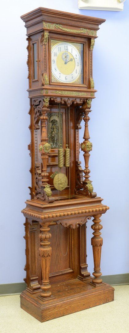 Oak Ansonia Antique Standing No 1 floor model clock: Oak Ansonia Antique Standing No 1 floor model clock, original finish, applied cast brass decorative elements, lacking crest board and finial, piece of spiral carved trim missing from inside top right 