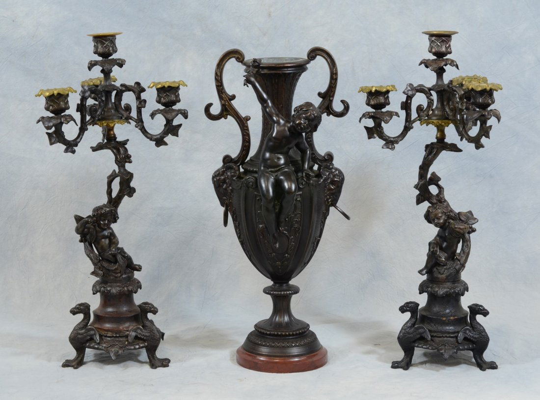 3-Piece Louis XV Style patinated spelter garniture set: 3-Piece Louis XV Style patinated spelter garniture set, double handle urn 16 1/2" h with a pair of 3-branch candelabra, 17 1/2" h
