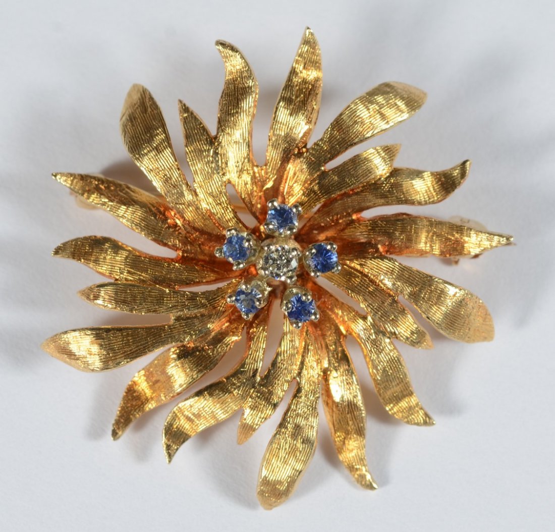 14K YG floral pin, center with small diamond and 5: 14K YG floral pin, center with small diamond and 5 green stones, 1 1/4" d, 3.9 dwt