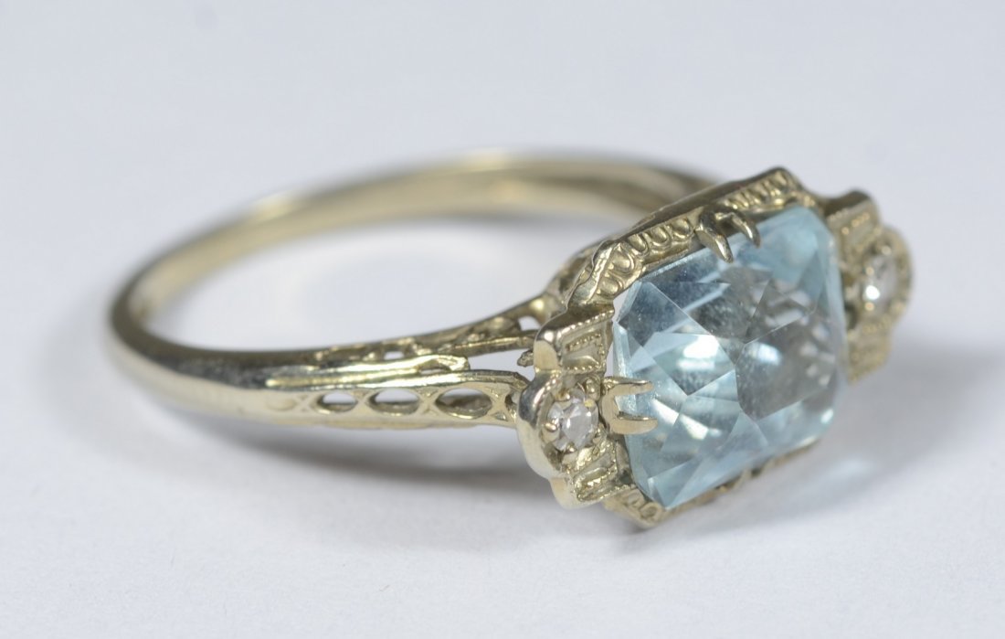 14K WG filigree ring with pale blue stone and 2 small: 14K WG filigree ring with pale blue stone and 2 small diamonds, 1.5 dwt, size 6 1/2